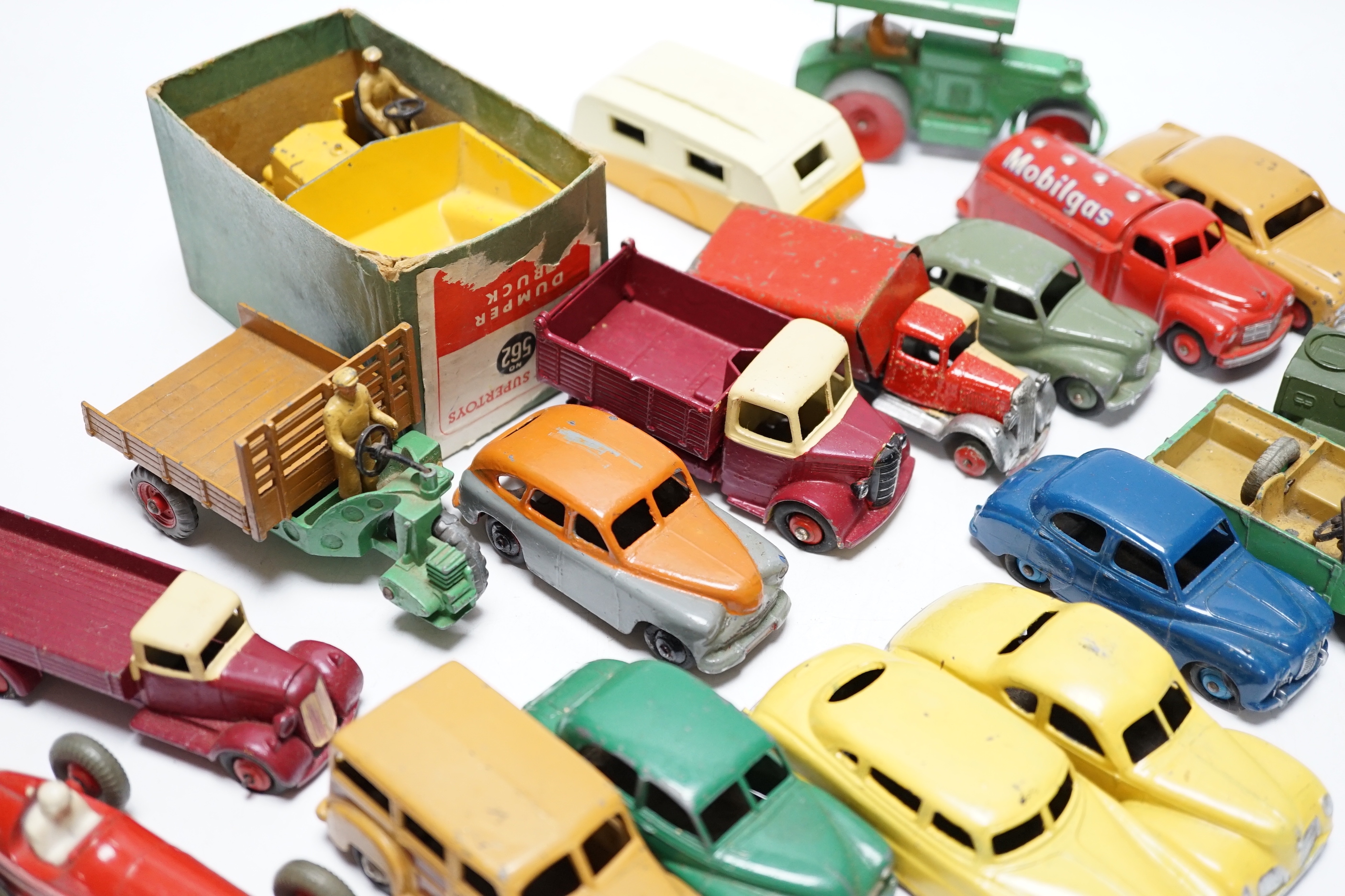 Nineteen Dinky Toys including; Mobilgas Tanker, Ford Sedan, Austin Devon, Austin Somerset, Standard Vanguard, Bedford Tipper, Hudson Sedan, etc.